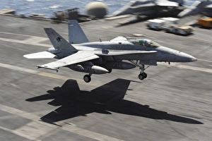 An F/A-18C Hornet lands aboard USS Dwight D. Eisenhower An F/A-18C Hornet lands aboard USS Dwight D. Eisenhower