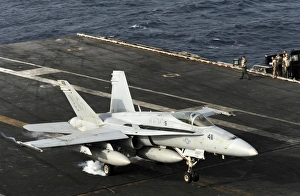 An F/A-18C Hornet lands on the flight deck of USS Abraham Lincoln An F/A-18C Hornet lands on the flight deck of USS Abraham Lincoln