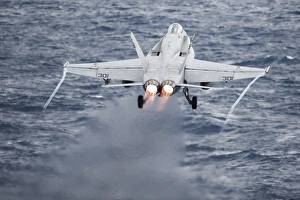 An F/A-18C Hornet launches from the flight deck of USS Harry S. Truman An F/A-18C Hornet launches from the flight deck of USS Harry S. Truman