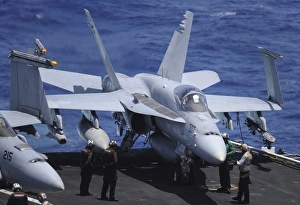 An F/A-18C Hornet sits ready for take off from the flight deck of USS Nimitz An F/A-18C Hornet sits ready for take off from the flight deck of USS Nimitz