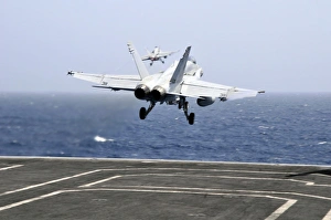 Two F/A-18C Hornet strike fighters launch from the aircraft carrier USS Ronald Reagan Two F/A-18C Hornet strike fighters launch from the aircraft carrier USS Ronald Reagan