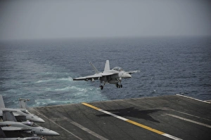 An F/A-18F Super Hornet lands on the aircraft carrier USS Nimitz An F/A-18F Super Hornet lands on the aircraft carrier USS Nimitz