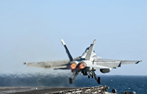An F/A-18F Super Hornet launches from the flight deck of aircraft carrier USS Nimitz An F/A-18F Super Hornet launches from the flight deck of aircraft carrier USS Nimitz