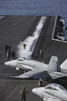 An FA-18D Hornet taxis to the catapult aboard the aircraft carrier USS Ronald Reagan An FA-18D Hornet taxis to the catapult aboard the aircraft carrier USS Ronald Reagan
