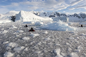 Filmmakers, photographers and scientists at work in brash ice behind Danco Island Filmmakers, photographers and scientists at work in brash ice behind Danco Island