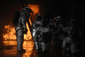 Firefighters extinguish a simulated cargo fire at RAF Mildenhall, England Firefighters extinguish a simulated cargo fire at RAF Mildenhall, England