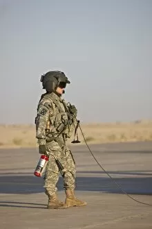 Images Dated 6th September 2009: A flight crew member stands by with a fire extinguisher