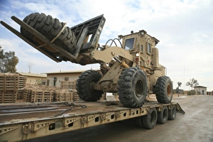 forklift is unloaded off of a logistics support vehicle forklift is unloaded off of a logistics support vehicle