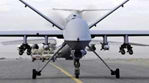 A fully armed MQ-9 Reaper taxis down an Afghanistan runway A fully armed MQ-9 Reaper taxis down an Afghanistan runway