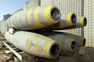 Six GBU-12 bombs sit in a rack inside a weapons storage area Six GBU-12 bombs sit in a rack inside a weapons storage area