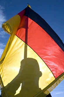 German Air Force Airman holds the German flag German Air Force Airman holds the German flag