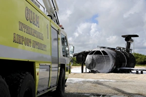 Guams WONPAT Airport practices putting out a fire on the aircraft fire trainer Guams WONPAT Airport practices putting out a fire on the aircraft fire trainer