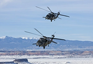 Two HH-60G Pave Hawks fly in formation over New Mexico Two HH-60G Pave Hawks fly in formation over New Mexico