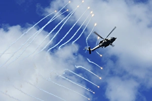 An HH-60H Sea Hawk helicopter releases countermeasure flares An HH-60H Sea Hawk helicopter releases countermeasure flares