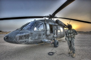 High dynamic range image of a door gunner beside a UH-60 Black Hawk High dynamic range image of a door gunner beside a UH-60 Black Hawk