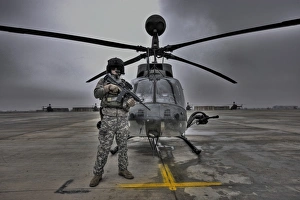 High dynamic range image of a pilot in front of a OH-58D Kiowa High dynamic range image of a pilot in front of a OH-58D Kiowa