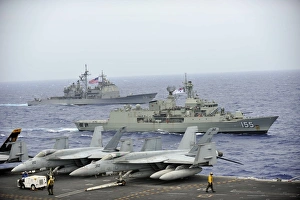 HMAS Ballarat of the Royal Australian Navy cruises alongside US Navy ships HMAS Ballarat of the Royal Australian Navy cruises alongside US Navy ships