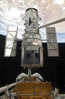Images Dated 19th May 2009: The Hubble Space Telescope is released from the cargo bay of Space Shuttle Atlantis