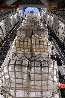 Humanitarian aid supplies loaded by Hawaii Air National Guard into a C-17 Globemaster III Humanitarian aid supplies loaded by Hawaii Air National Guard into a C-17 Globemaster III