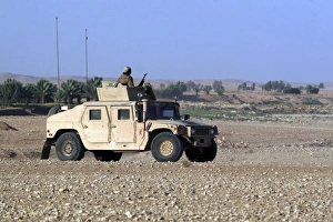 A humvee filled with Marines conducting a mounted combat patrol A humvee filled with Marines conducting a mounted combat patrol