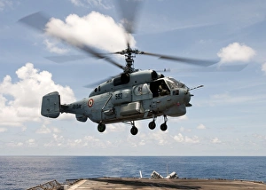 An Indian Navy Kamov Ka-31 lands on the flight deck of USS Bunker Hill An Indian Navy Kamov Ka-31 lands on the flight deck of USS Bunker Hill