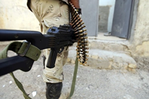 Iraqi soldiers carrying machine guns and rifles Iraqi soldiers carrying machine guns and rifles