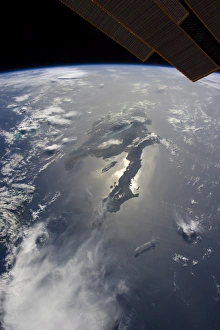 The island of Hispaniola with sunglint illuminating the peninsula of Haiti The island of Hispaniola with sunglint illuminating the peninsula of Haiti