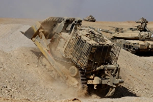 An Israel Defense Force Caterpillar D-9 clearing the way An Israel Defense Force Caterpillar D-9 clearing the way