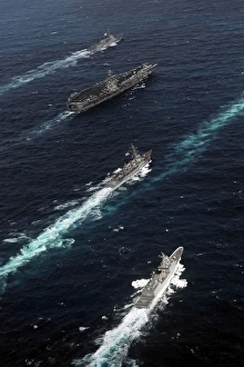 The John C. Stennis Carrier Strike Group are underway in formation with naval vessels The John C. Stennis Carrier Strike Group are underway in formation with naval vessels