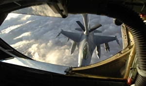 A KC-135 Stratotanker connects with an F-16 Fighting Falcon A KC-135 Stratotanker connects with an F-16 Fighting Falcon