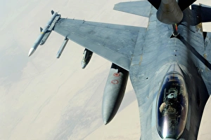 A KC-135 Stratotanker refueling an F-16CJ Fighting Falcon over Iraq A KC-135 Stratotanker refueling an F-16CJ Fighting Falcon over Iraq