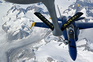 A KC-135 Stratotanker refuels an F/A-18 Hornet A KC-135 Stratotanker refuels an F/A-18 Hornet