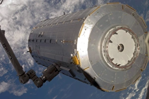 The Kibo Japanese Pressurized Module in the grasp of the robotic Canadarm2 The Kibo Japanese Pressurized Module in the grasp of the robotic Canadarm2