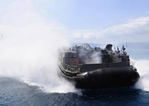 A landing craft air cushion travels at high speed off the coast of Okinawa, Japan A landing craft air cushion travels at high speed off the coast of Okinawa, Japan