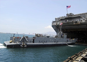 Landing Craft Utility moving into position near amphibious assault ship USS Essex in Landing Craft Utility moving into position near amphibious assault ship USS Essex in
