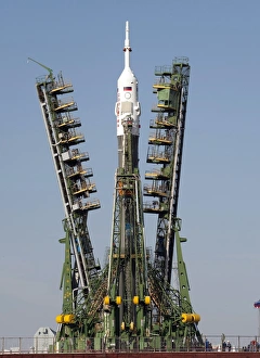 Launch scaffolding is raised into place around the Soyuz rocket Launch scaffolding is raised into place around the Soyuz rocket