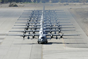 A line of C-130 Hercules taxi at Nellis Air Force Base, Nevada A line of C-130 Hercules taxi at Nellis Air Force Base, Nevada