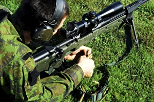 A Lithuanian special operations soldier engages targets with an assault rifle A Lithuanian special operations soldier engages targets with an assault rifle