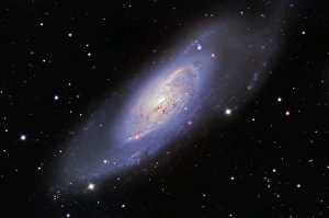 <b class=qtipBold><figcaption>M106 Spiral Galaxy</figcaption></b><br>M106 Spiral Galaxy harboring our nearest extragalactic jet taken with clear red green blue filter set and hydrogen alpha filters<br><em>© Ken Crawford/Stocktrek Images</em> M106 Spiral Galaxy