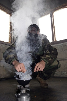 A marine fills the gas chamber with more CS gas A marine fills the gas chamber with more CS gas