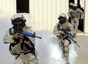 Marines cross a danger area after using a smoke grenade to conceal their movement Marines cross a danger area after using a smoke grenade to conceal their movement
