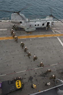 Marines embark a CH-46E Sea Stallion helicopter aboard USS Makin Island Marines embark a CH-46E Sea Stallion helicopter aboard USS Makin Island