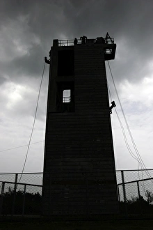 Marines rappel from the Camp Hansen Rappel Tower Marines rappel from the Camp Hansen Rappel Tower
