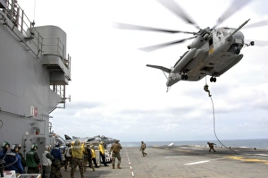 Marines and sailors fast-rope from a CH-53E Super Stallion Marines and sailors fast-rope from a CH-53E Super Stallion