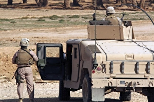 Marines watch the surrounding desert during a Mounted Combat Patrol Marines watch the surrounding desert during a Mounted Combat Patrol