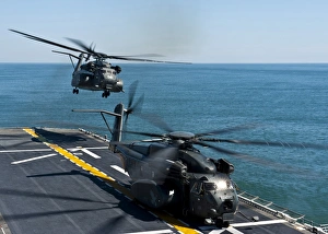 MH-53E Sea Dragon helicopters take off from the flight deck of USS Wasp MH-53E Sea Dragon helicopters take off from the flight deck of USS Wasp