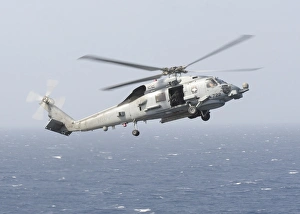 An MH-60R Sea Hawk helicopter prepares to land An MH-60R Sea Hawk helicopter prepares to land
