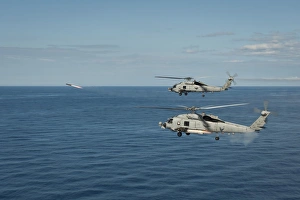 MH-60R Sea Hawk helicopters launch AGM-114 hellfire missiles MH-60R Sea Hawk helicopters launch AGM-114 hellfire missiles