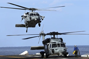 An MH-60S Sea Hawk approaches the amphibious assault ship USS Kearsarge An MH-60S Sea Hawk approaches the amphibious assault ship USS Kearsarge