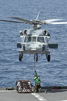 A MH-60S Sea Hawk helicopter lifts supplies from the fantail of USNS Amelia Earhart A MH-60S Sea Hawk helicopter lifts supplies from the fantail of USNS Amelia Earhart